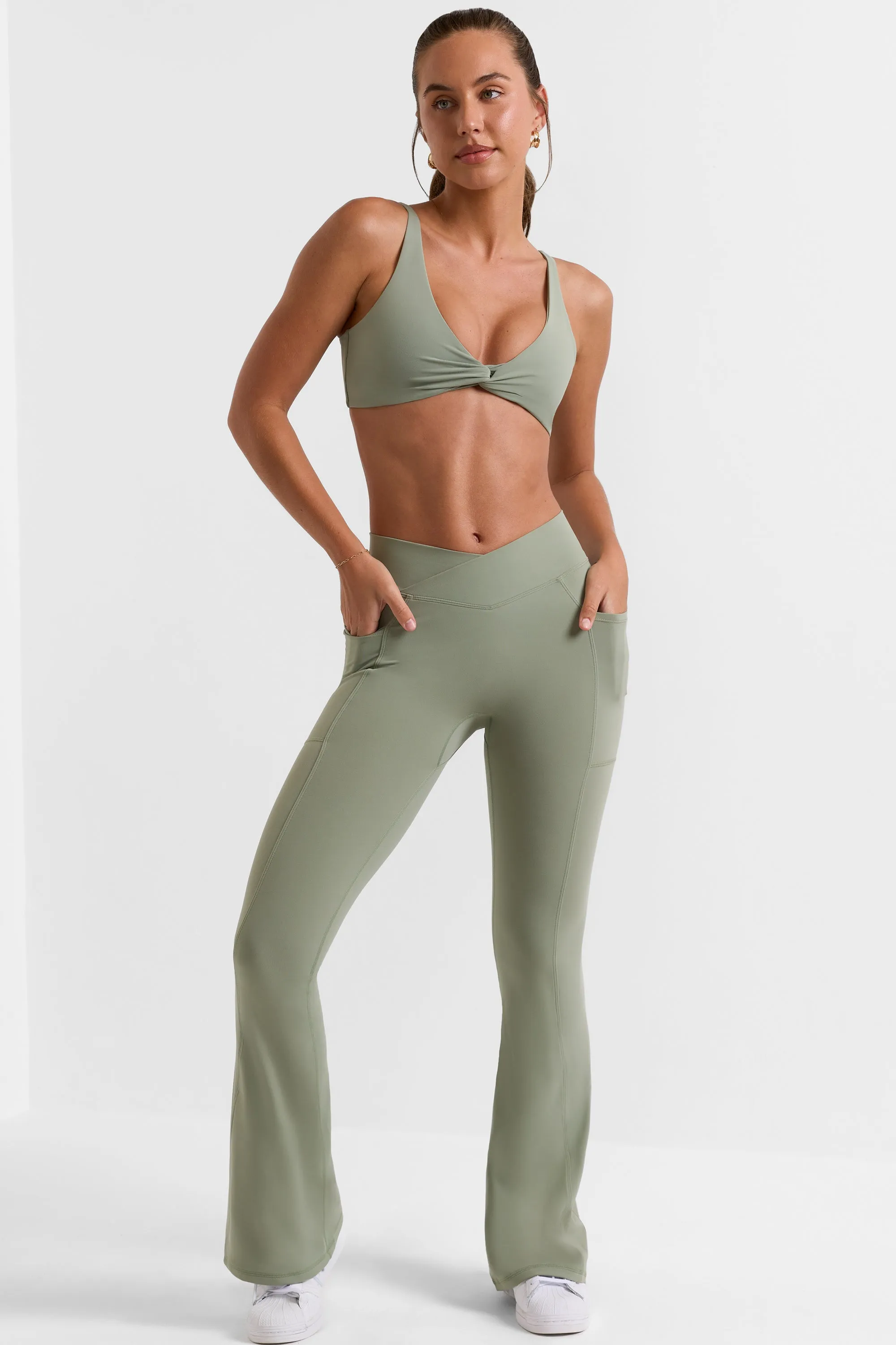 Cross Waistband Flare Pocket Leggings in Bamboo Green